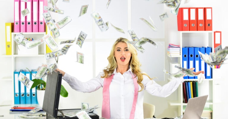 woman throwing cash in air - 30 ways to make $1,000 a day.
